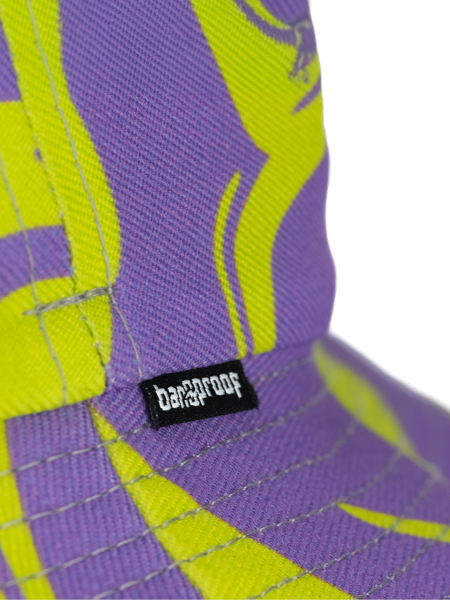 Close-up of a colorful Bangproof hat featuring a vibrant design and the Bangproof logo.
