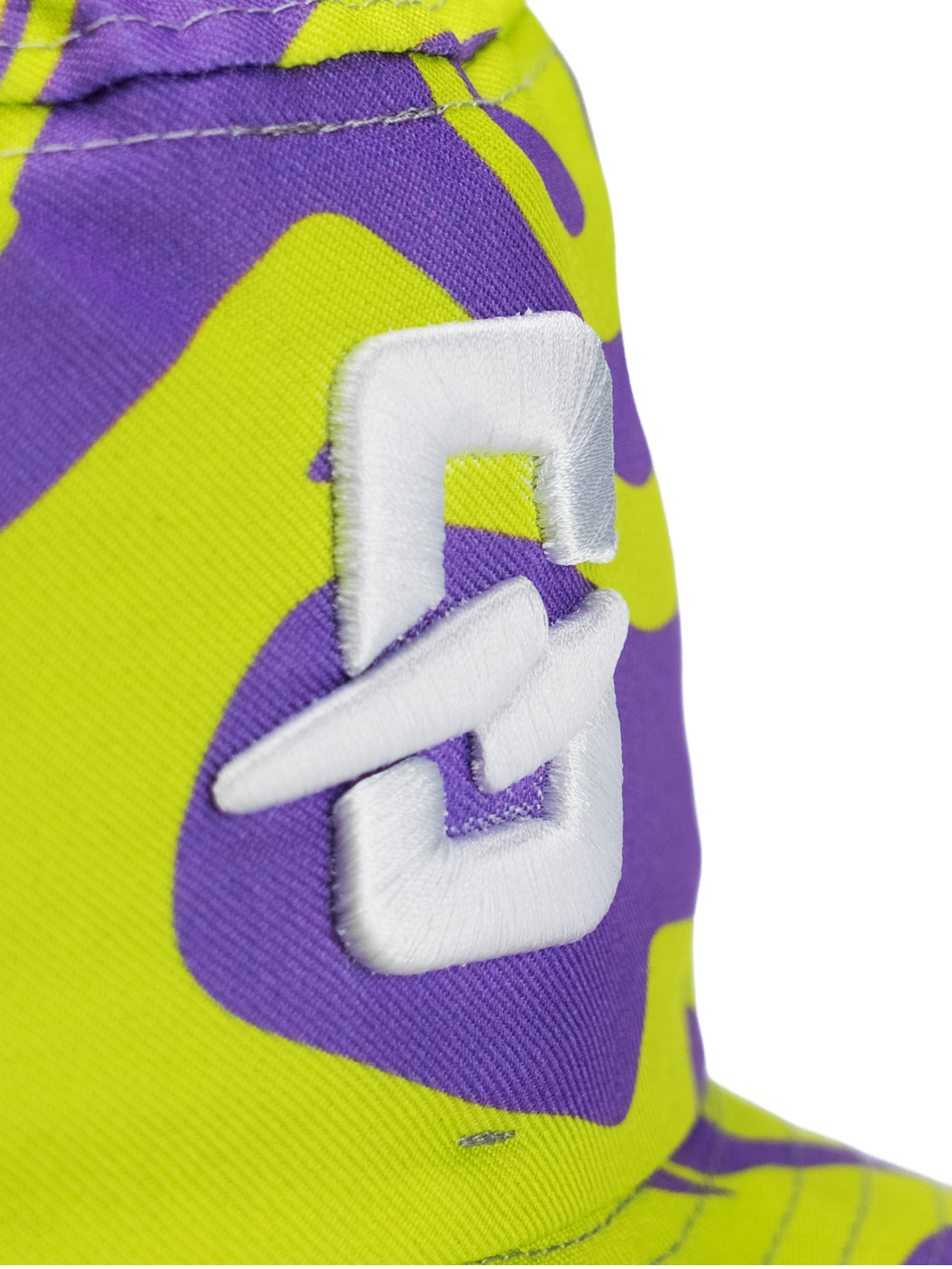 Colorful design of a bucket hat featuring a white logo on a patterned background.