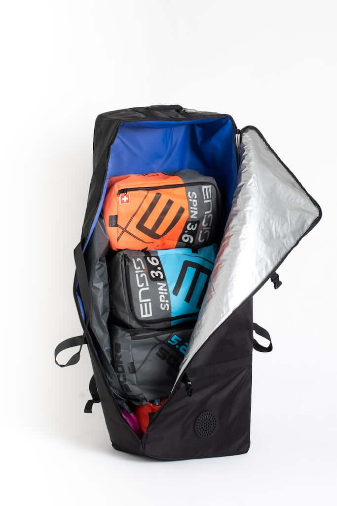 Waterproof wing foiling gear bag with colorful gear organized neatly inside, showcasing its spacious design.