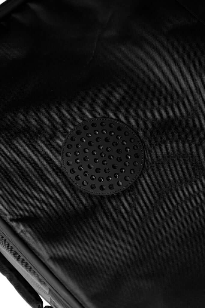 Close-up of the waterproof wing foiling gear bag showing its durable, waterproof fabric and textured surface.