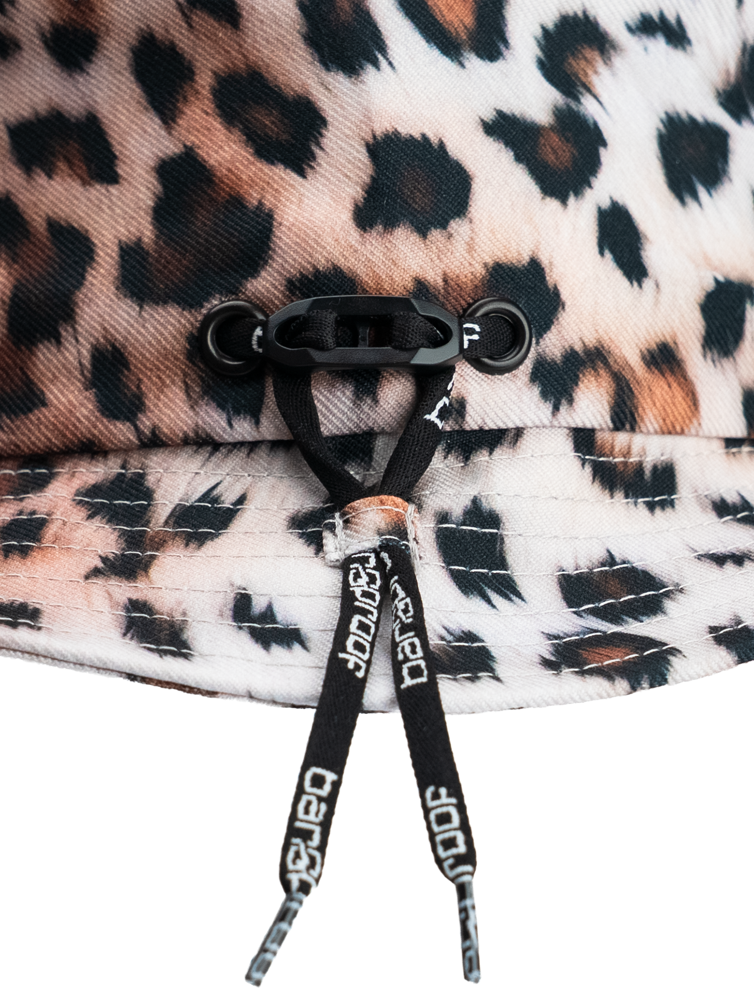 Detail of the Bangproof Helmet V2 showcasing the adjustable fit system in a leopard print design.