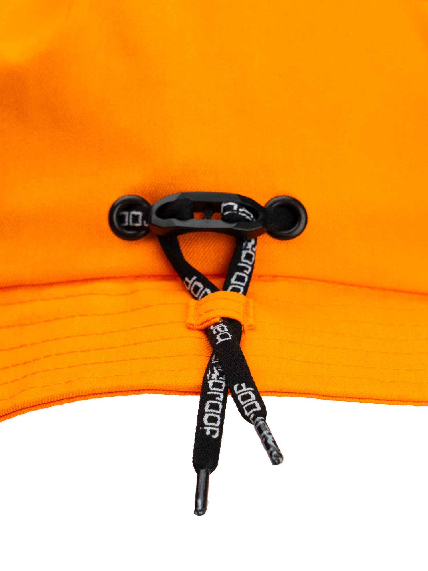 Close-up of the adjustable fit system on the Bangproof Helmet V2, featuring orange fabric and black retention straps.