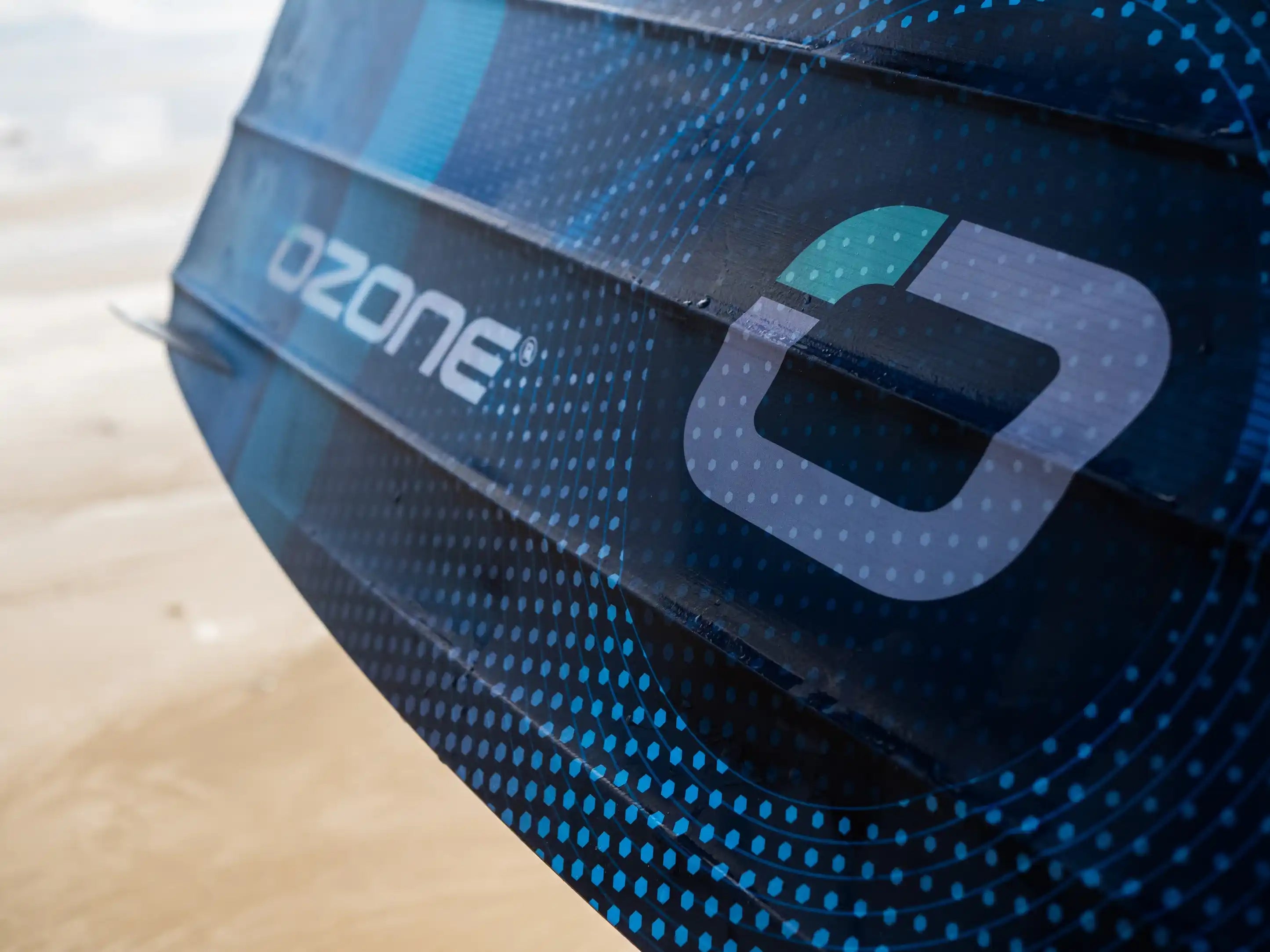 Close-up of Ozone Torque V4 Twintip showcasing its sleek design and branding, perfect for big air, freeride, and freestyle.