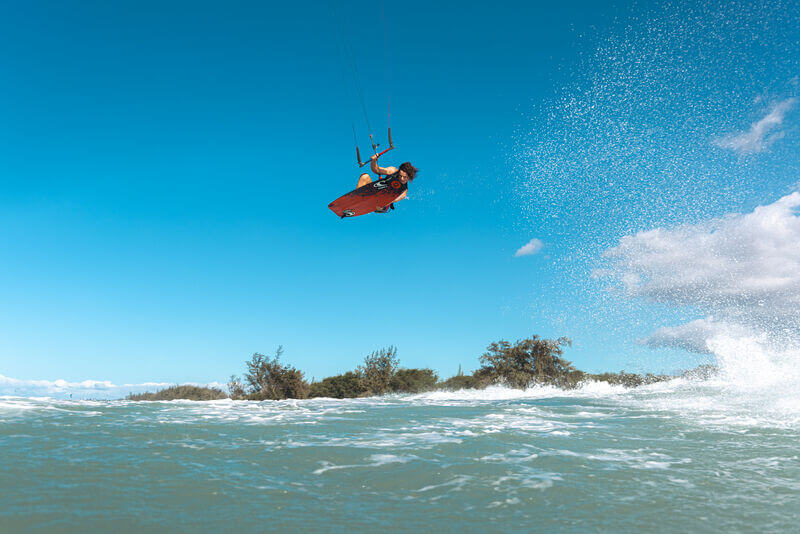 Ozone Code V5 Kiteboard – Freeride Performance Twintip in action, rider jumping over water
