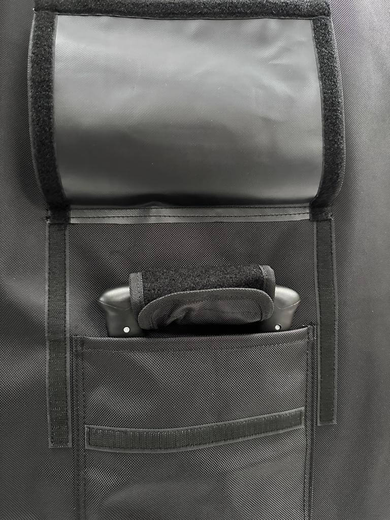 Close-up of pockets and handle on the FBC Wing Foil Travel Bag V2 for easy storage and accessibility.