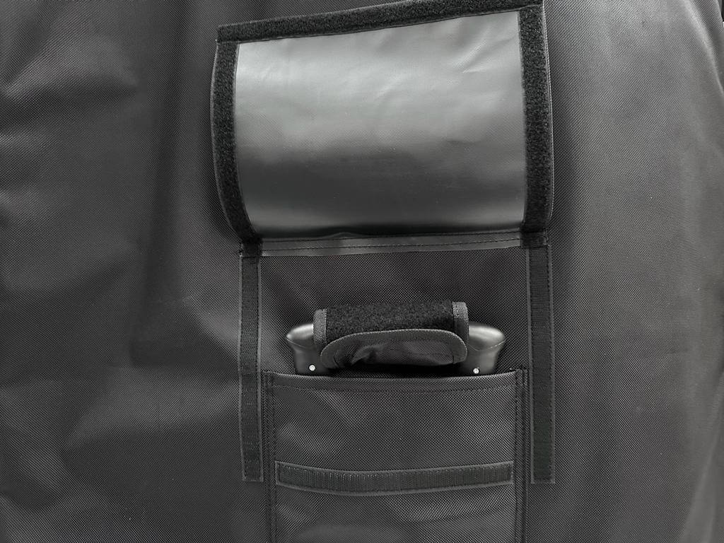 Wingfoil travel bag pocket detail showcasing storage options and handle for easy carrying.
