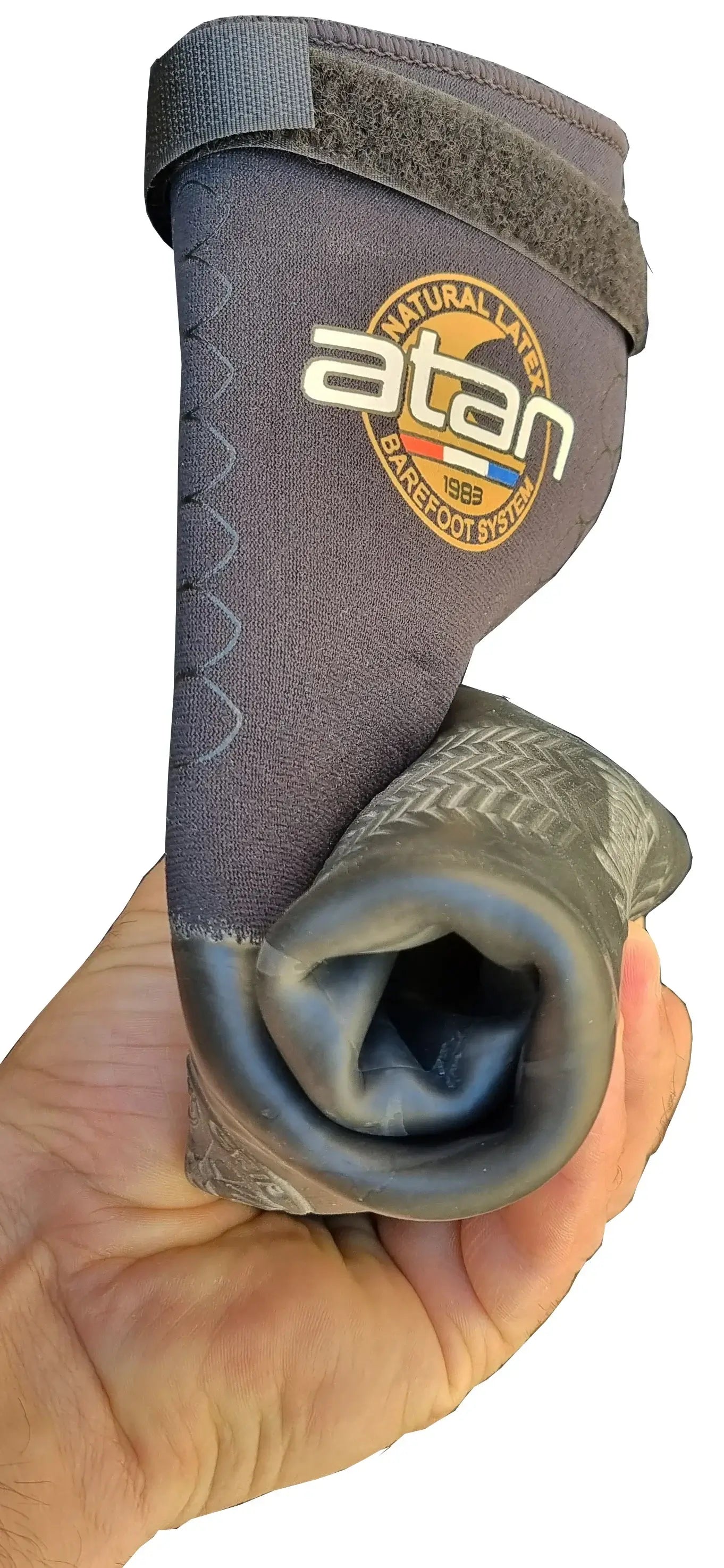 Atan HOT MISTRAL GECKO Boots 6mm | Barefoot Feel Wetsuit Boots in hand showcasing flexible design and logo.