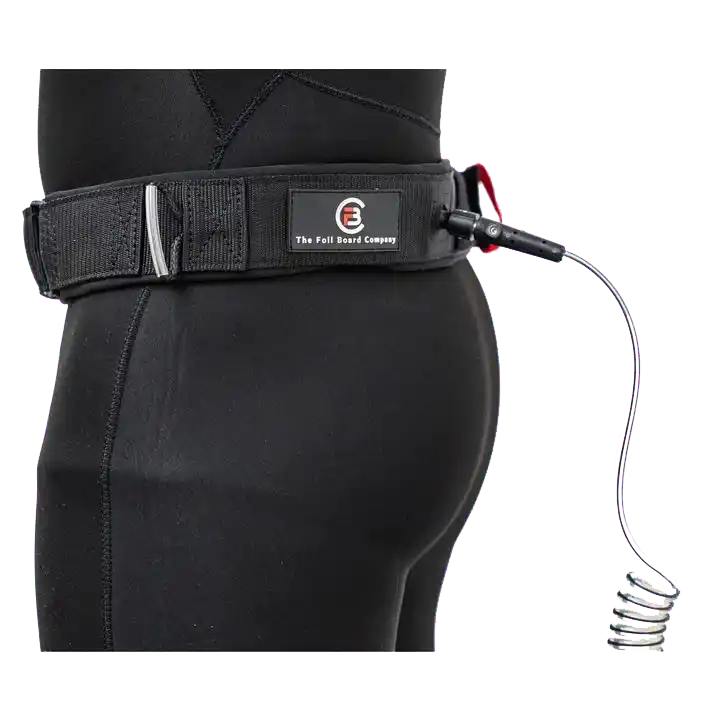 Wingfoil board waist leash attached to a wetsuit, showcasing the FBC Board Waist Leash V2's design and safety features.