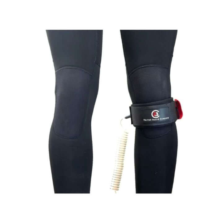 Wingfoil Board Knee Leash attached to a rider's knee, showcasing coiled design and reliable connection.
