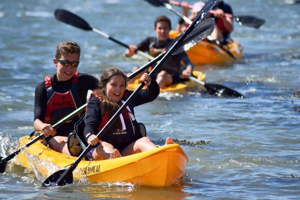 Two people enjoying the 'MAHEE' Double Seater Kayak Yellow Package Deal 🟡 during a paddling adventure.