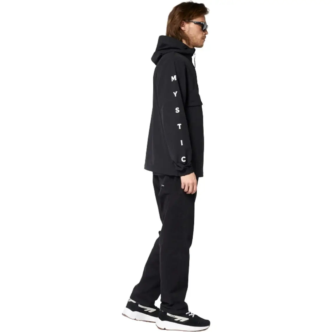 Model wearing the Mystic Seascape Jacket | Waterproof Windproof Jacket in black with stylish graphics.