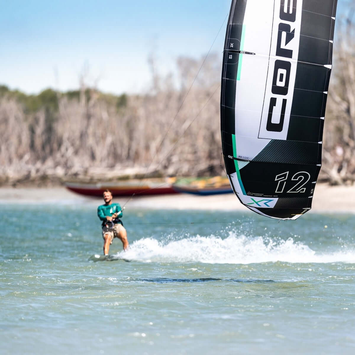 Kitesurfing action with a rider and a CORE kite, illustrating the excitement of the sport and its gear.