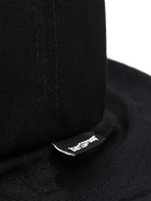 Close-up of the Bangproof Helmet V2 showcasing its durable fabric and branding for reliability in extreme sports.