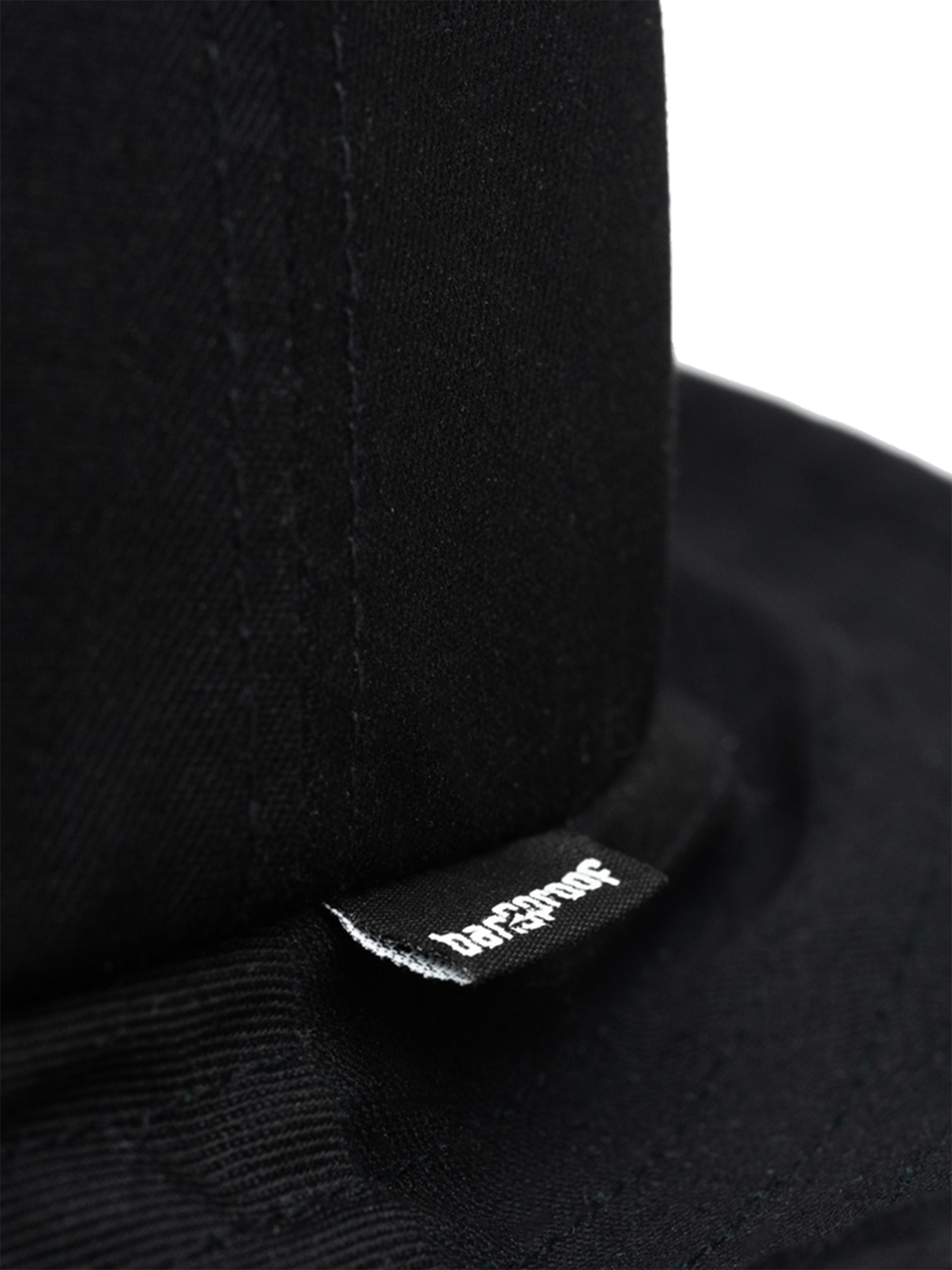 Close-up of the Bangproof Helmet V2 showcasing its durable fabric and branding for reliability in extreme sports.