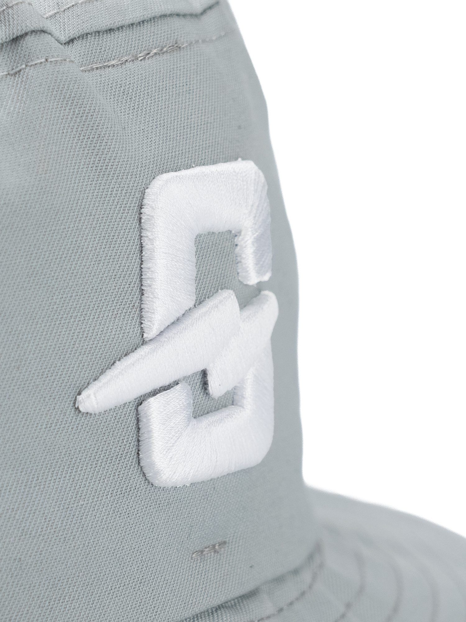 Close-up of the embroidered logo on a gray hat featuring a stylish design.