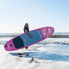 Fatstick AirStick 10'6 Inflatable SUP Package 2026 on the beach with a user paddling.