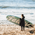 Fatstick AirStick 10'6 Inflatable SUP Package 2026 on the beach with a paddler ready to enjoy the water.
