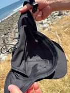 Solite Convertible MAX Watersports Hat detail showing the adjustable chin strap and cord-lock rear adjuster.