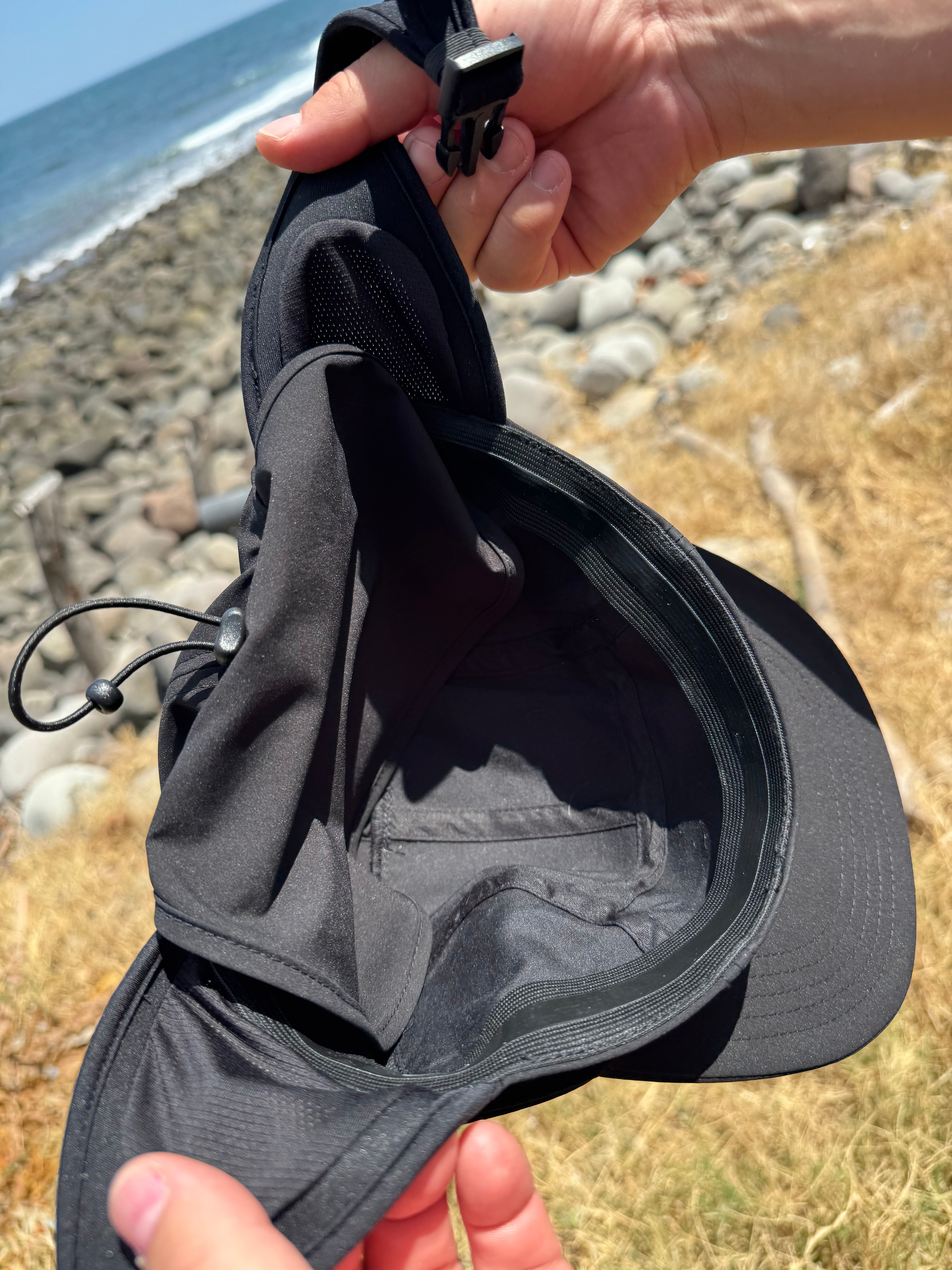 Solite Convertible MAX Watersports Hat detail showing the adjustable chin strap and cord-lock rear adjuster.