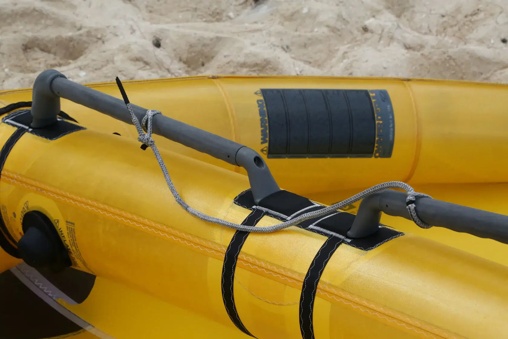 Ozone Flux V2 Ultra-X – Freeride Without Limits yellow inflatable paddle details on sandy beach