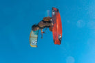 Ozone Code V5 Kiteboard – Freeride Performance Twintip in action with a rider jumping in the air.