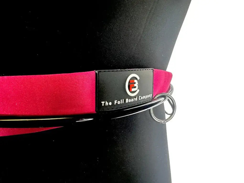 FBC Wing Waist Leash V2 RAD Edition close-up on a mannequin, showcasing the pink strap and attachment ring.