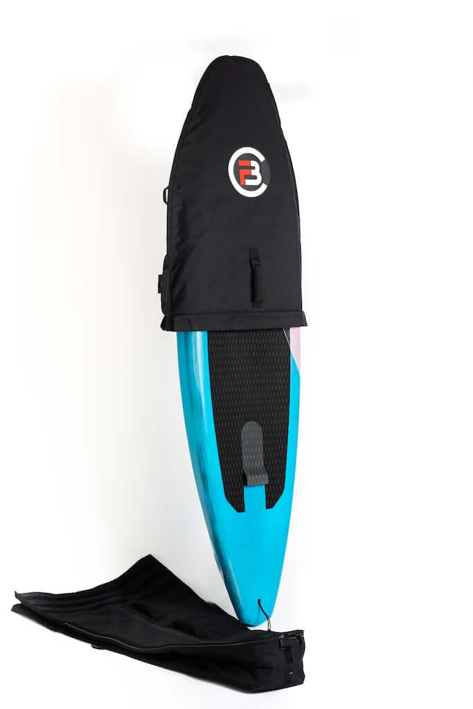 FBC Midlength Adjustable Bag Pro+ | Downwind/Wingfoil Bag on a blue SUP board, showcasing innovative design.