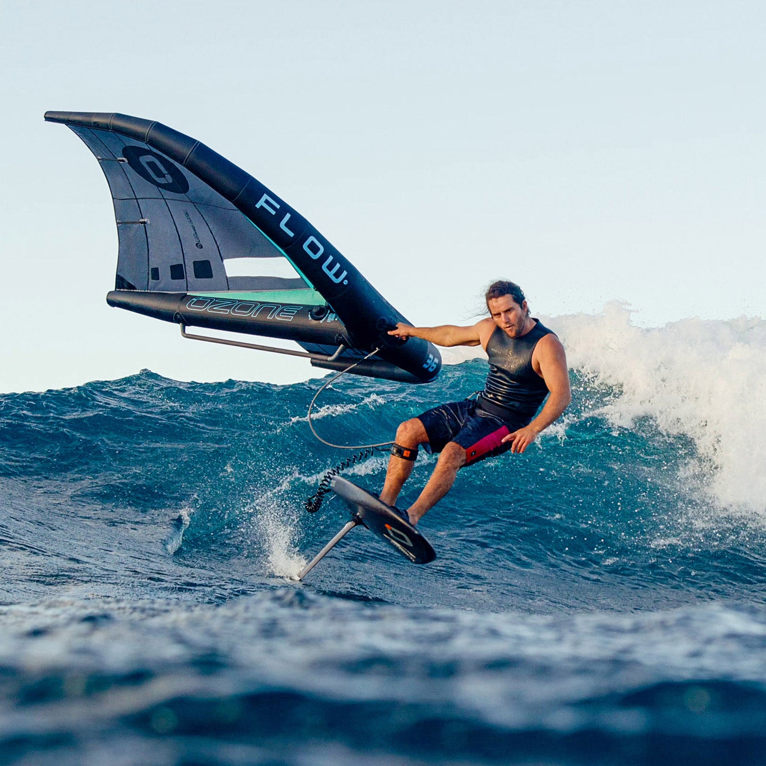 Ozone Flow V2 | Wing in action, showcasing a rider foiling on waves with a stylish design and confidence-inspiring performance.